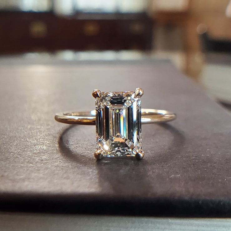 Silas engagement ring with 1.57 carat lab grown emerald cut diamond and hidden halo in recycled 14k yellow gold with thin dainty band 