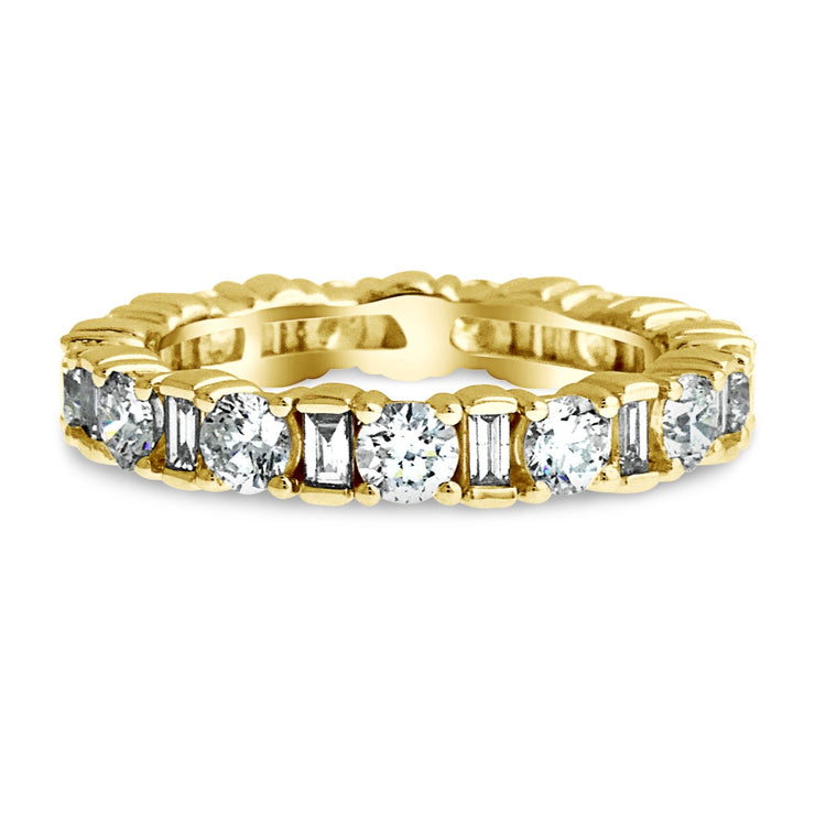 Eternity engagement band with prong-set round and baguette diamonds set in Yellow Gold. Handmade by Dana Walden Jewelry.