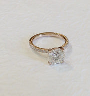 Video of a rose gold diamond engagement ring with small diamond accents in the band. Dana Walden Bridal NYC.