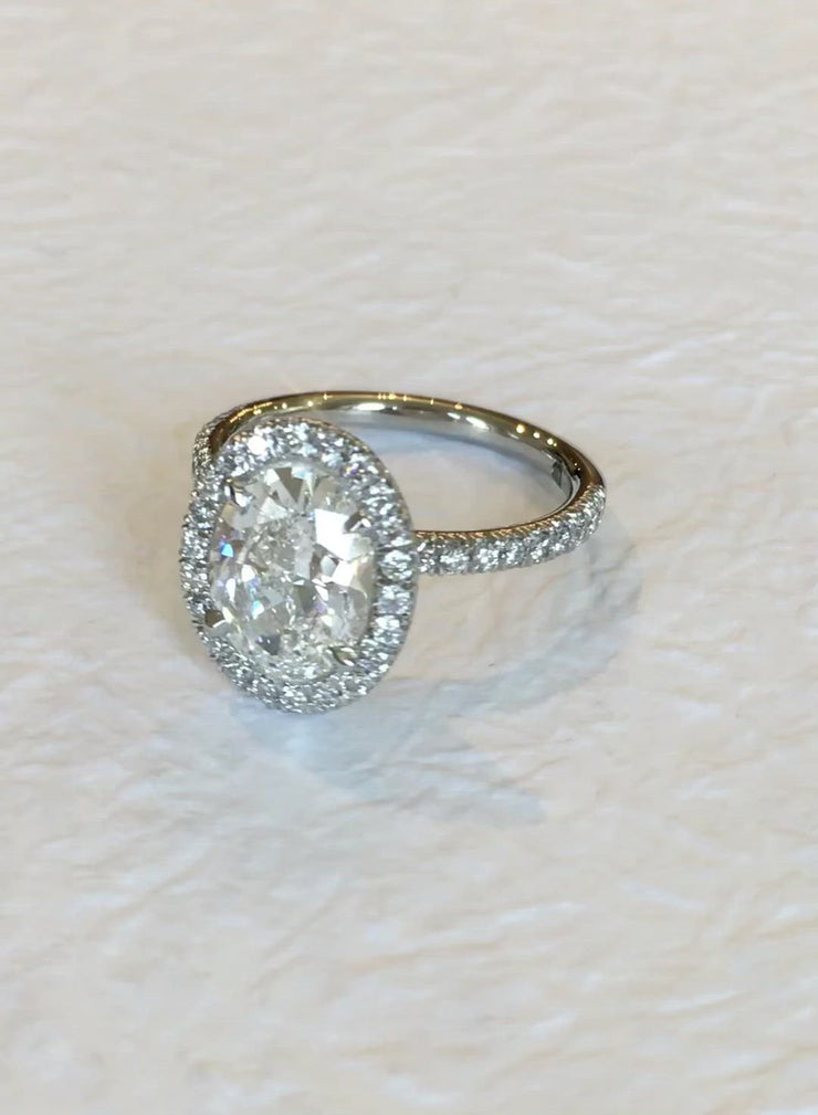 Video of Conflict free oval diamond halo engagement ring by Dana Walden Jewelry in NYC.