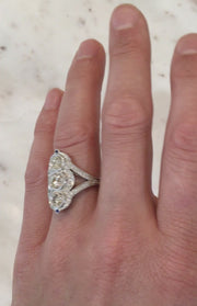 Charlotte three diamond engagement ring with split shank band and micro pave diamond accents. Made in New York City.