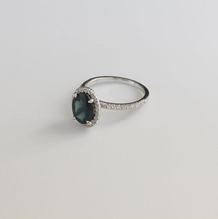 VIDEO Teal sapphire with diamond halo and diamond micro pave set in white gold. DANA WALDEN BRIDAL. 