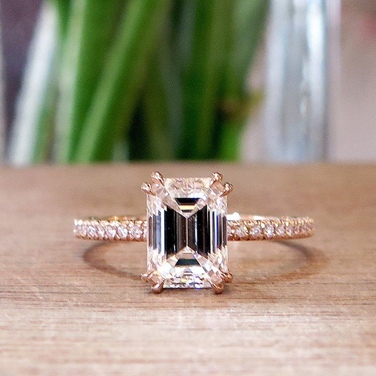 Rose gold emerald step cut engagement ring by Dana Walden Bridal in NYC.