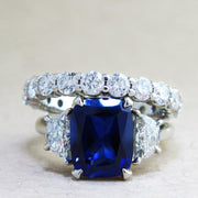 Alexandra 4 Carat Blue Sapphire Engagement Ring with Half-Moon Diamond Side Stones in White Gold by Dana Walden Bridal