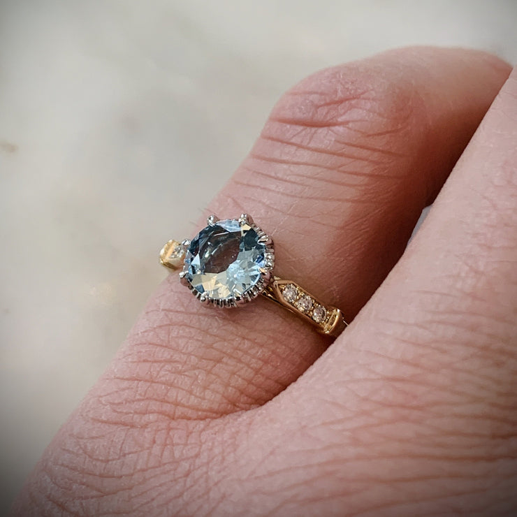 Unique aquamarine engagement ring in yellow gold with vintage inspired details & low profile - shown on hand - Aminta