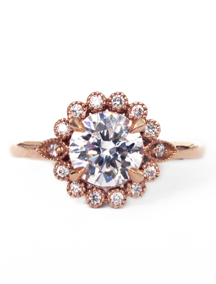 Handmade unique diamond halo engagement ring that resembles a floral bloom. Rose gold setting handmade by Dana Walden Bridal NYC.