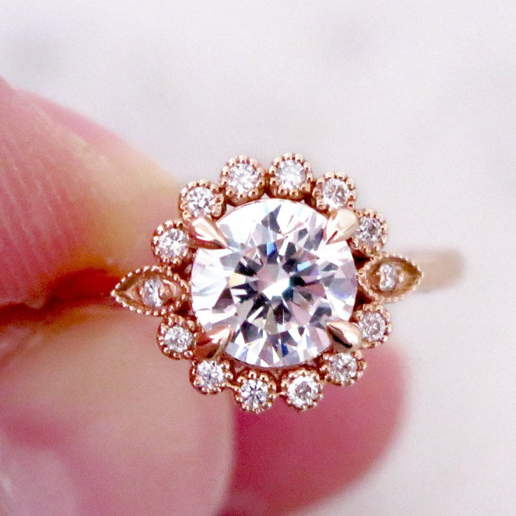 Handmade unique diamond halo engagement ring that resembles a floral bloom. Rose gold setting handmade by Dana Walden Bridal NYC.