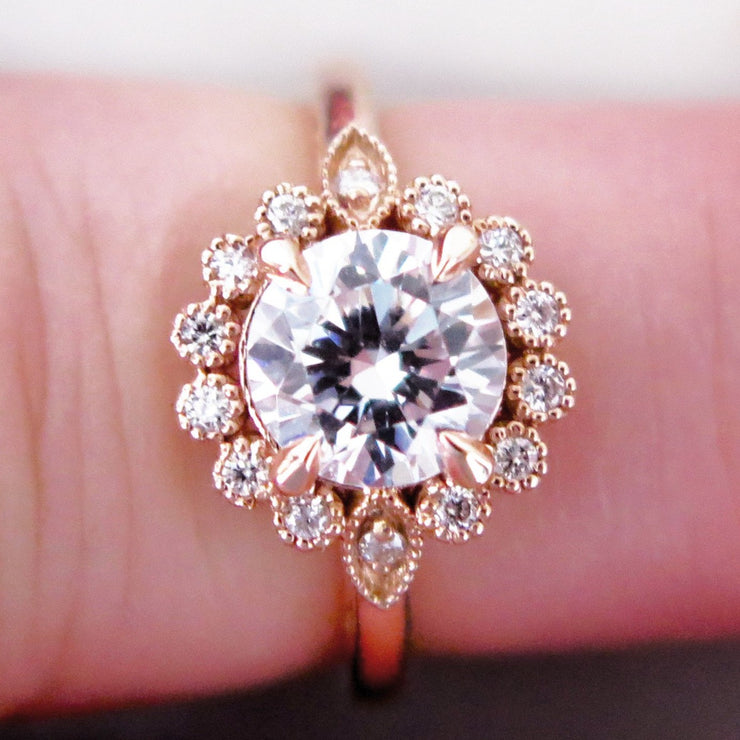 Handmade unique diamond halo engagement ring that resembles a floral bloom. Rose gold setting handmade by Dana Walden Bridal NYC.