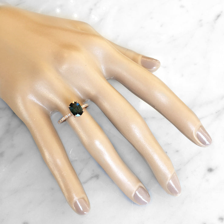 Anisa teal sapphire engagement ring with rose gold band by DANA WALDEN.