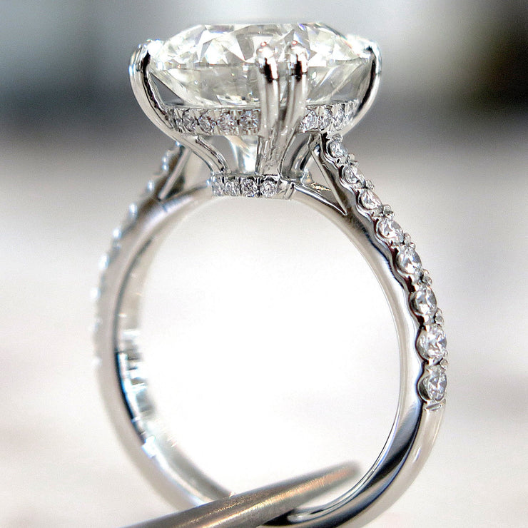 Side View of 5 carat diamond engagement ring with diamonds in delicate thin band 