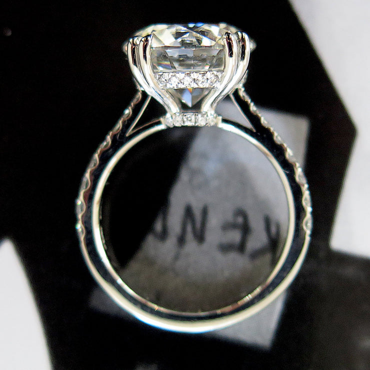 5 carat round diamond engagement ring paved with diamonds underneath in platinum