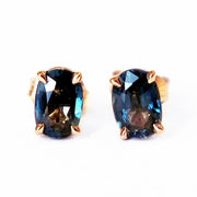 Oval stud earrings with juicy and rich teal sapphires in a rose gold setting. Designed and handmade by Dana Walden NYC.