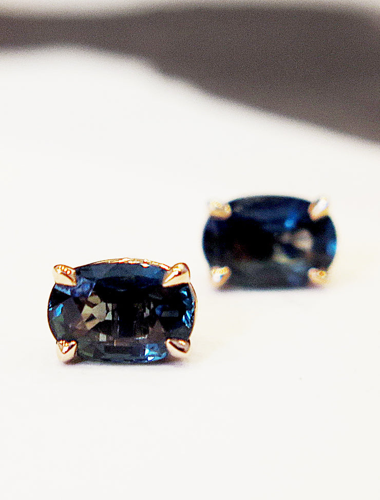 Oval stud earrings with juicy and rich teal sapphires in a rose gold setting. Designed and handmade by Dana Walden NYC.