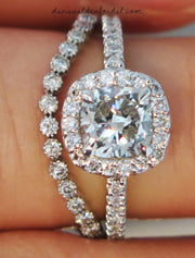 Diamond halo engagement ring with curved diamond band. Made in New York City.