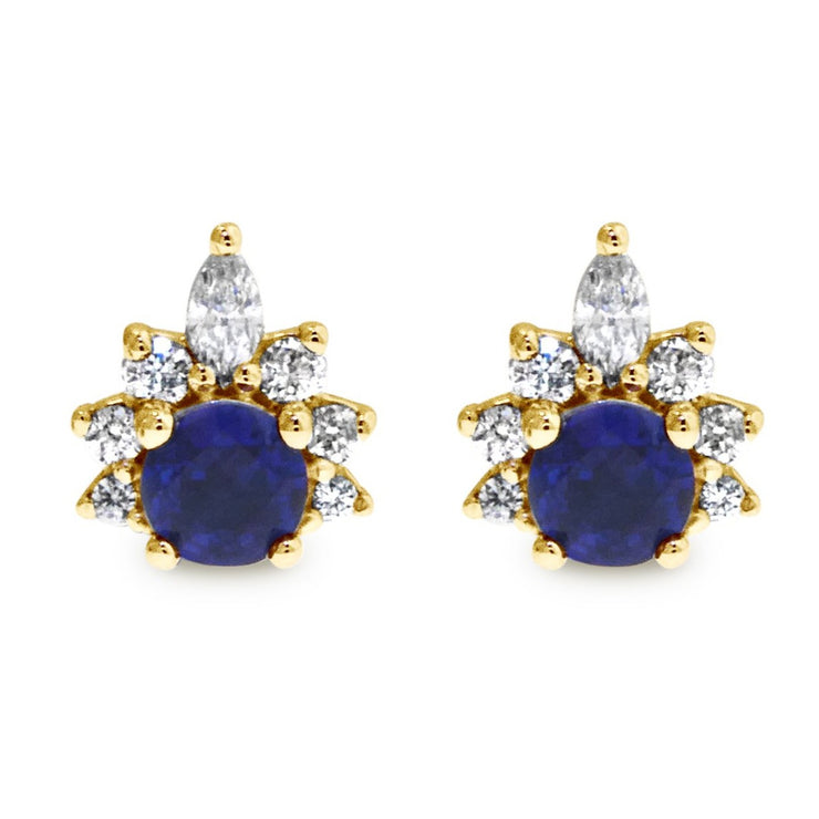 Deep blue sapphire earrings with diamond demi halo. Stud earrings set in yellow gold by Dana Walden.