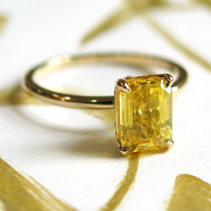 Unique emerald cut yellow sapphire engagement ring in gold - nontraditional & alternative