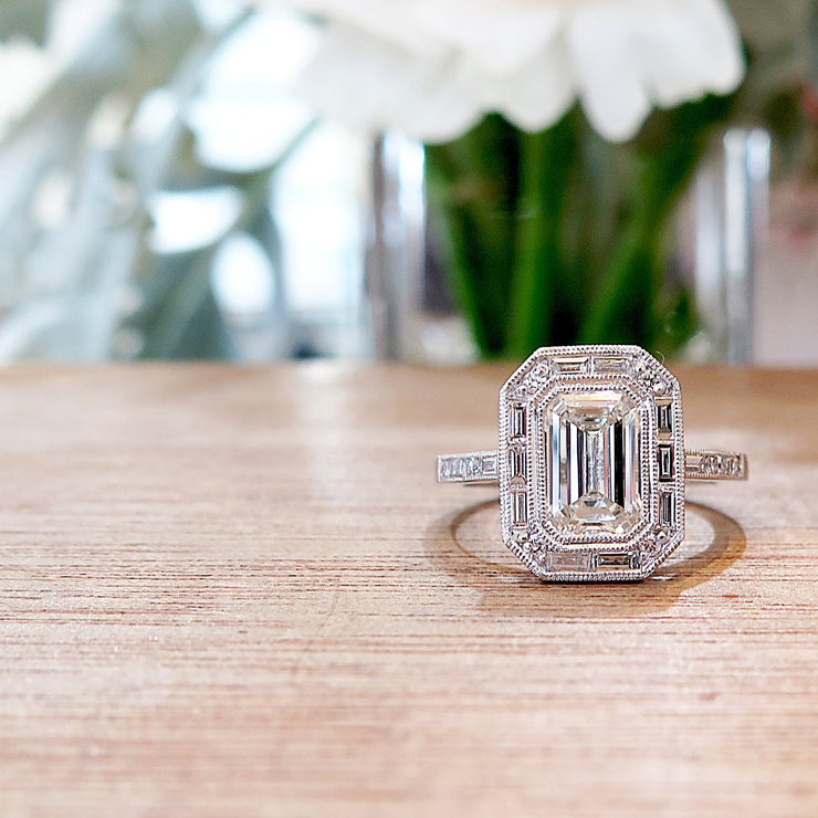 Custom Emerald Cut Halo Engagement Ring with Baguette and Round Diamonds in Platinum