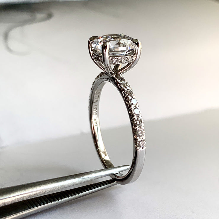 Side view of a unique diamond solitaire engagement ring made with responsibly-sourced diamonds. Made in NYC by Dana Walden Jewelry.