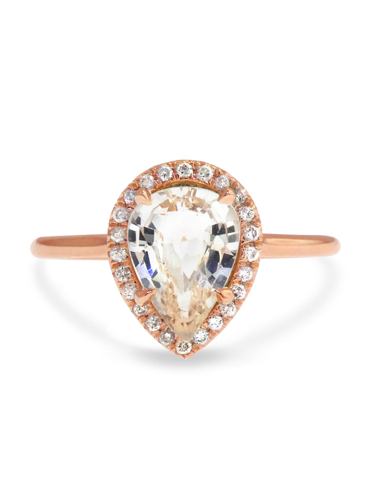 pale peach sapphire engagement ring in rose gold halo design with conflict free diamonds, by dana walden bridal in nyc