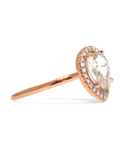 pale peach sapphire engagement ring in rose gold halo, side image, designed by Dana Walden Bridal in NYC