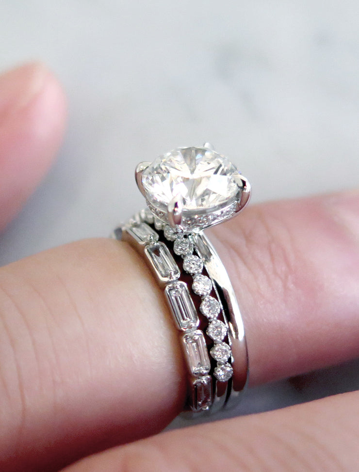 Unique lab diamond solitaire with thin diamond stacking bands in platinum.