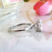 Unique diamond solitaire engagement ring with secret diamonds in platinum - side profile