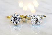 Timeless diamond solitaire engagement rings in platinum and yellow gold