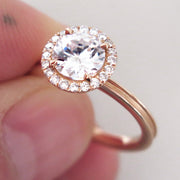 Rose gold halo engagement ring with unique beveled band and conflict free diamonds handmade in nyc