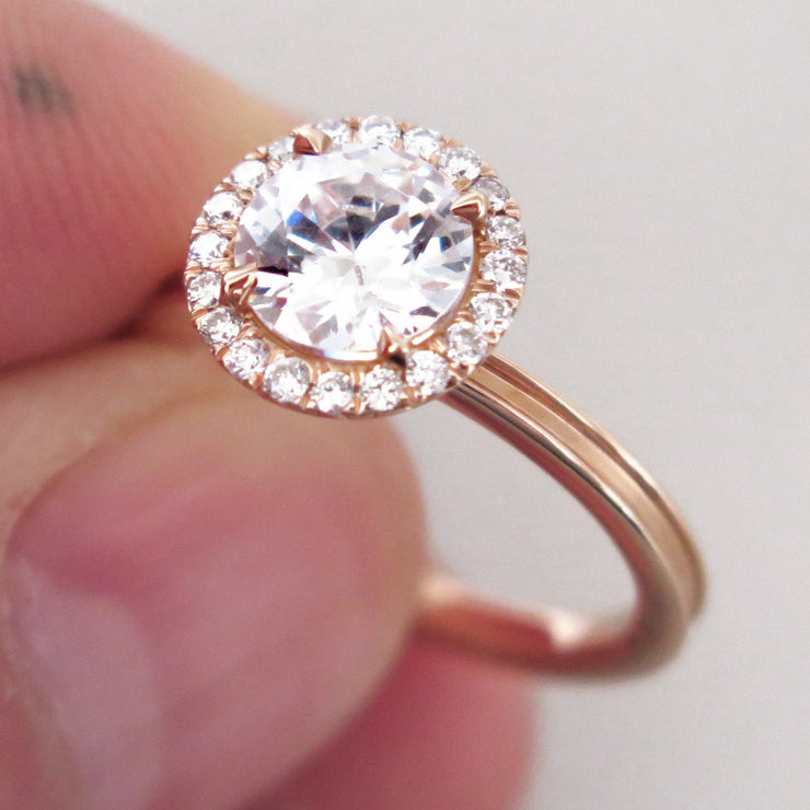 Rose gold halo engagement ring with unique beveled band and conflict free diamonds handmade in nyc