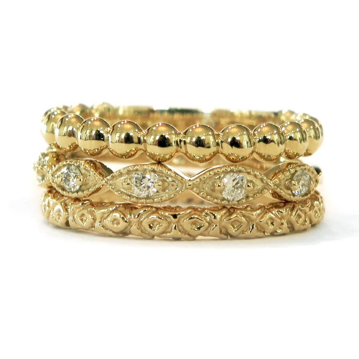 Set of three handmade stacking wedding rings in yellow gold. DANA WALDEN BRIDAL.