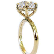 Gracie six prong yellow gold solitaire with peek-a-boo diamonds and delicate band