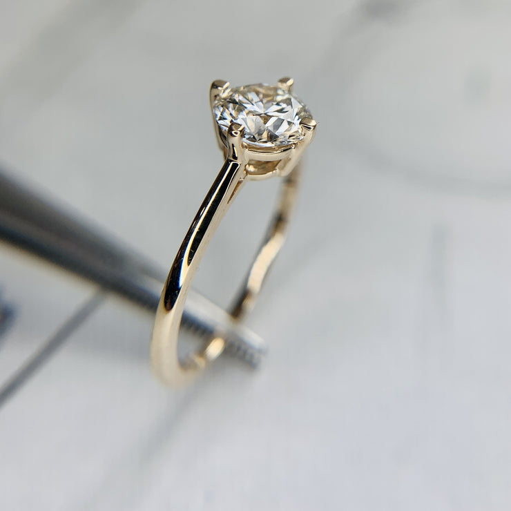 1 carat lab diamond engagement ring set in 14k yellow gold. DANA WALDEN BRIDAL.