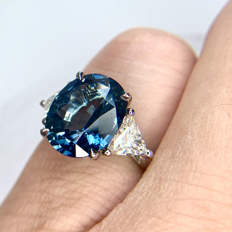 On hand: 5 carat blue oval sapphire engagement ring by Dana Walden Bridal- Three stone ring.