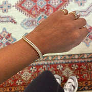 Rad wearing yellow gold and white gold diamond tennis bracelets- DANA WALDEN JEWELRY NYC.