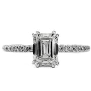 Platinum engagement ring with emerald-cut center diamond and micro pave band. Ethically handmade in NYC.