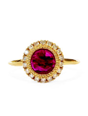 Ruby and diamond halo engagement ring in yellow gold with vintage inspired details