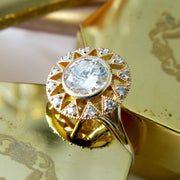 Artistic diamond engagement ring in yellow gold with milgrain and diamond accents handmade in nyc