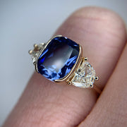 Blue sapphire engagement ring set in yellow gold with lunette diamond accents - Dana Walden Bridal NYC