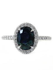 Teal sapphire with diamond halo and diamond micro pave set in white gold. DANA WALDEN BRIDAL. 