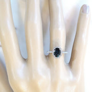 Teal sapphire with diamond halo and diamond micro pave set in white gold. DANA WALDEN BRIDAL. 