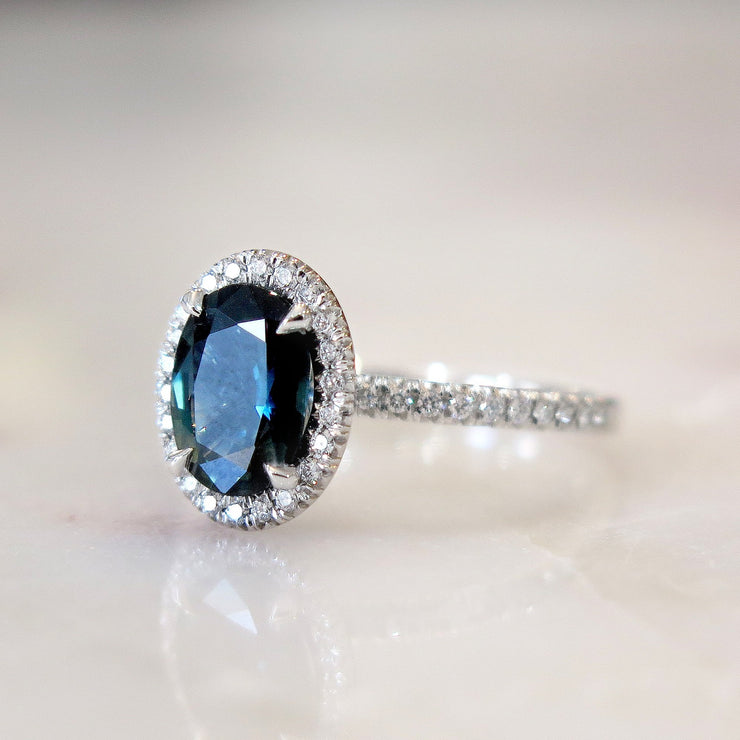 Teal sapphire with diamond halo and diamond micro pave set in white gold. DANA WALDEN BRIDAL. 