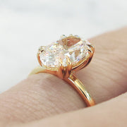 Oval lab diamond solitaire engagement ring set in yellow gold. Dana Walden NYC