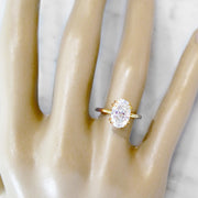 Oval lab diamond solitaire engagement ring set in yellow gold. Dana Walden NYC