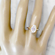 2 carat oval diamond solitaire, yellow gold engagement ring, ultra thin band, on hand