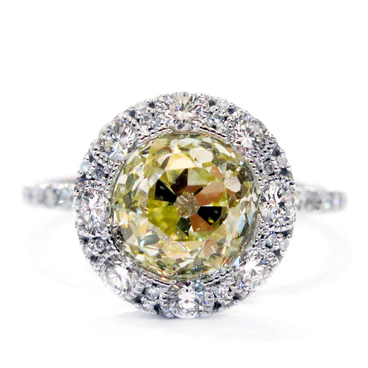 Old mine yellow diamond  with white diamond halo. DANA WALDEN BRIDAL NYC.