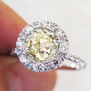 Old mine yellow diamond  with white diamond halo. DANA WALDEN BRIDAL NYC.