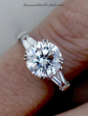 Classic three stone diamond engagement ring with baguettes on hand - Leandra
