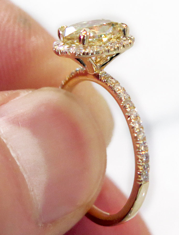 Linza yellow diamond engagement ring on hand in yellow gold - delicate, thin, low-profile