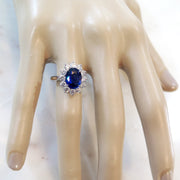 Custom Kate Middleton style sapphire engagement ring on hand