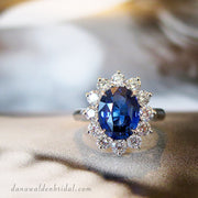 Kate Middleton style custom engagement ring featuring a 3 carat oval cut royal blue sapphire